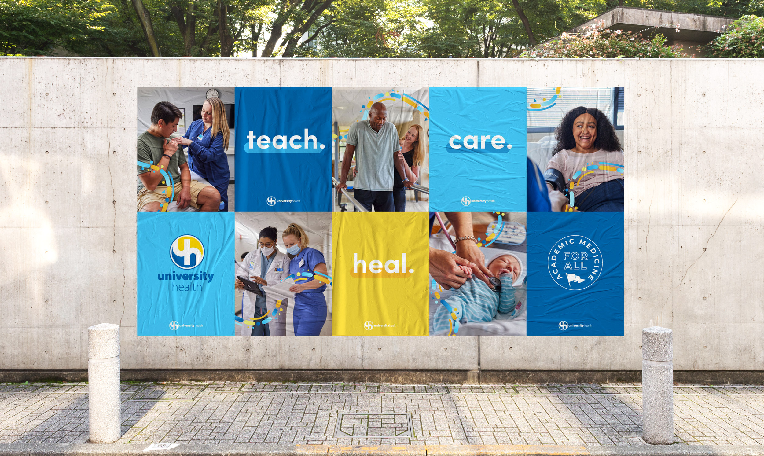 set of posters on an outdoor wall. images of UH staff and patients. says 